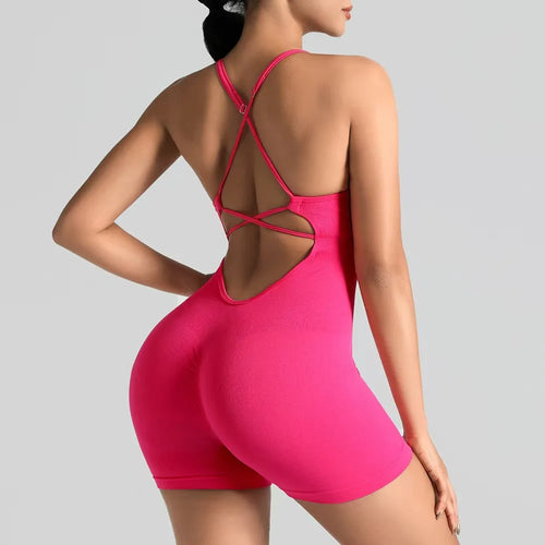 Pink swimsuit with open back on a gray background